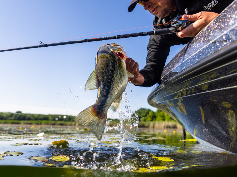 Fisherman with bass caught on Star Rods freshwater rod