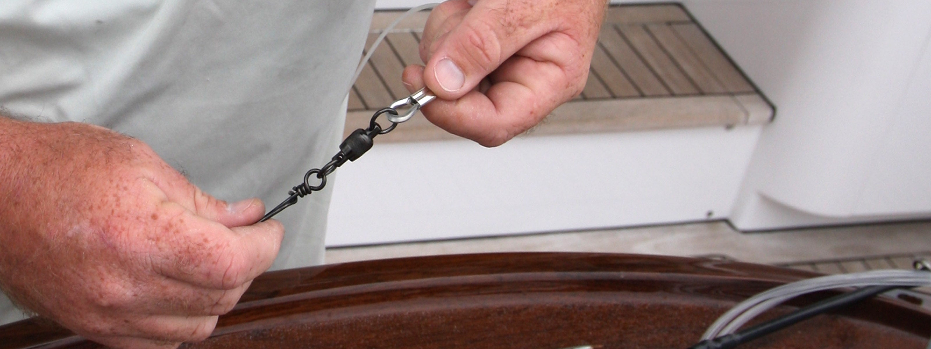 Billfisher swivel in fisherman's hands