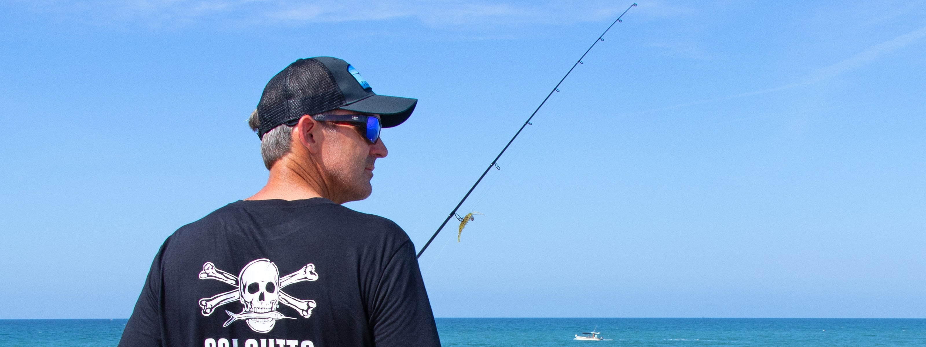 Fisherman wearing Calcutta T-shirt and Calcutta fishing sunglasses