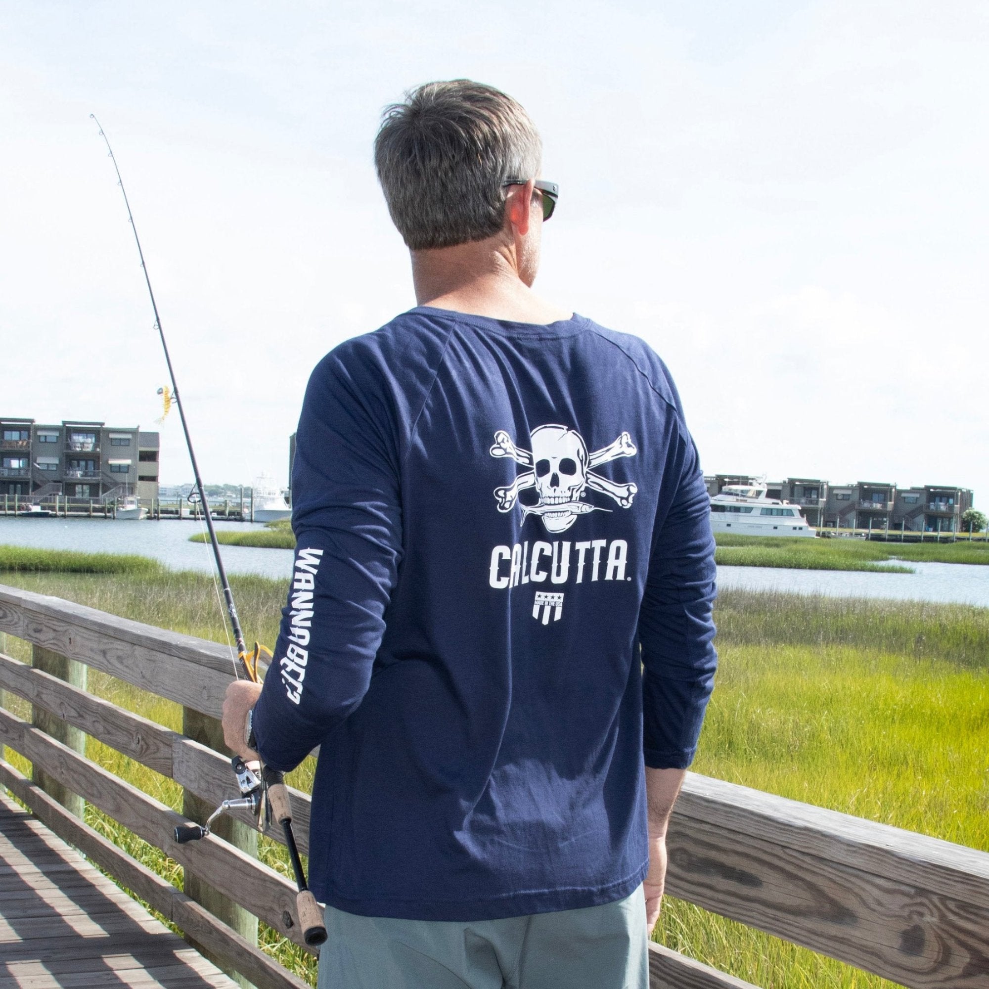 Fisherman wearing Calcutta Beech Head made in USA long sleeve shirt