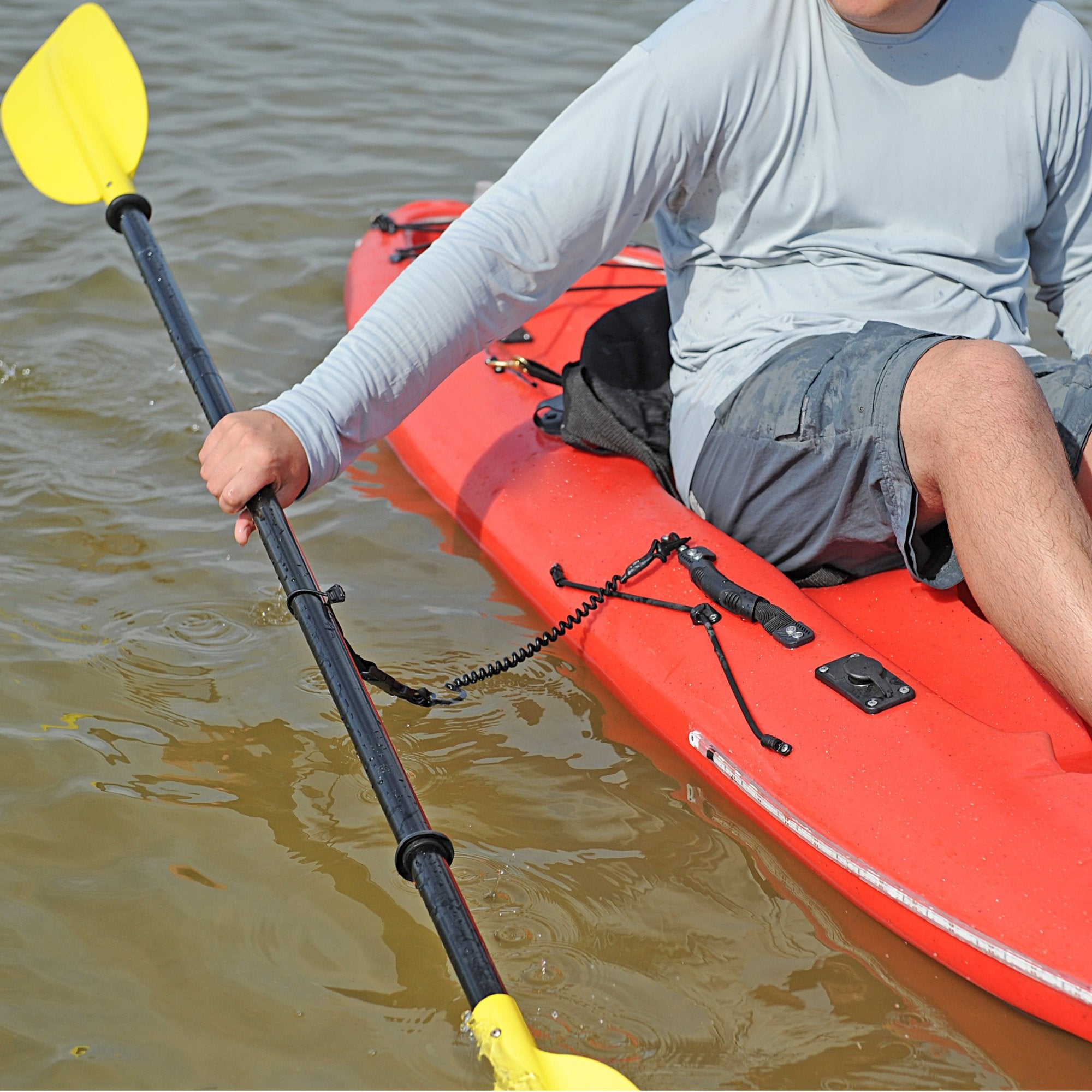 Kayak paddle leash in use