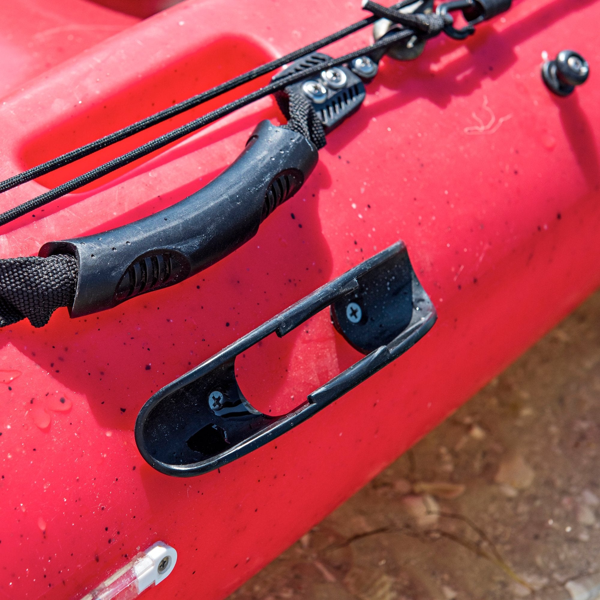 Kayak paddle outlet holder for trailer