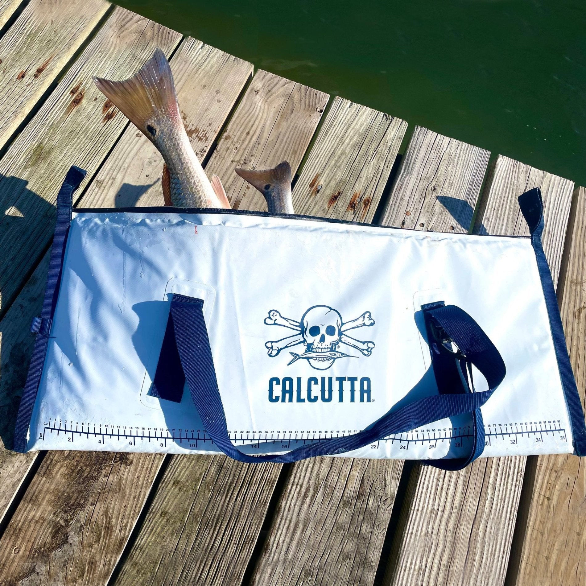 Calcutta fish cooler bag with redfish tails