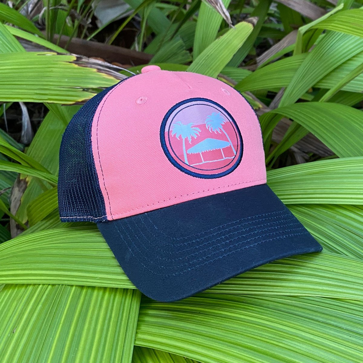 Pink Calcutta hat on tropical leaves