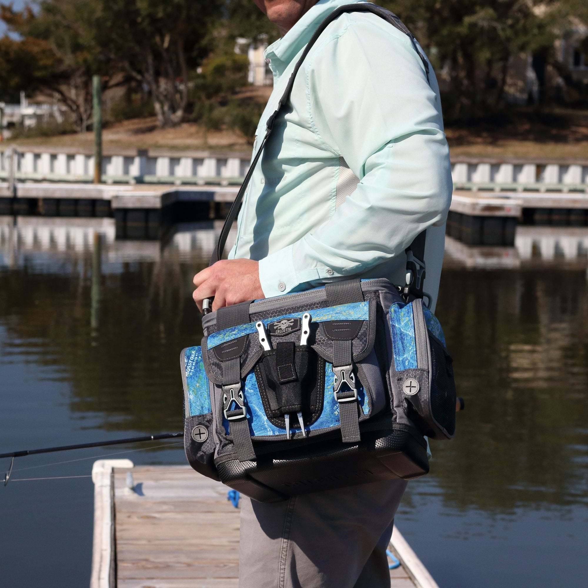 Calcutta tackle bag on fisherman's shoulder